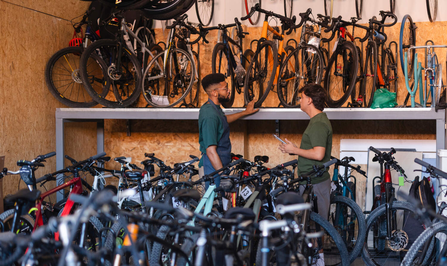 People managing bicycle inventory in sustainable store